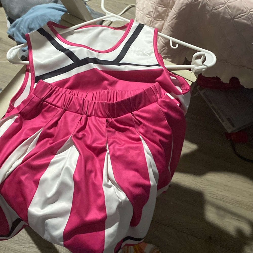 Pink black and white cheer costume it is used